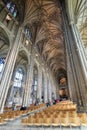 Interior with aisle between the seats in the majestic Canterbury Cathedral, UK