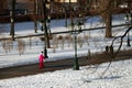People walk in Alexanders Garden in Moscow in winter.