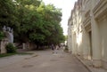 People walk along the coastal alley in Varna
