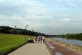 People walk along the embankment in the Moscow estate Kolomenskoye