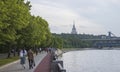 People walk along the embankment of the Moscow River Royalty Free Stock Photo