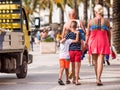 People walk along the embankment, Salou, Tarragona, Spain. Close-up.