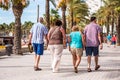 People walk along the embankment, Salou, Tarragona, Spain. Copy space for text.