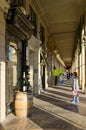 People walk along famous arcade on Rivoli street, Paris, France