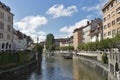 People walk along Ljubljanica river in Ljubljana, Slovenia Royalty Free Stock Photo