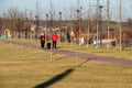 People walk along the new embankment of the Irpin river