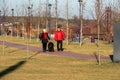 People walk along the new embankment of the Irpin river