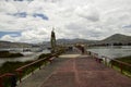 People walk along the pier on Lake Titicaca. Puno, Peru