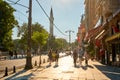 People walk along the sidewalk at Sultanahmet Square in Istanbul