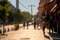 People walk along the sidewalk at Sultanahmet Square in Istanbul
