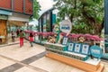 People walk along Stanley Plaza dog-friendly shopping center by the dog memorial on Hong Kong Island in Hong Kong city