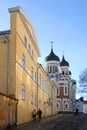People walk along a street near the Alexander Nevsky Cathedral in Tallinn, Estonia