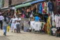 People walk along a street in Pinnawala.