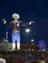 People walk around Big Tex at night Royalty Free Stock Photo