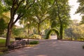 People walk around the city park during sunset in Gomel, Belarus.. Royalty Free Stock Photo