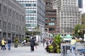 People walk around the South Street Seaport Square