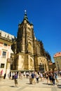 People walk around St. Vitus Cathedral