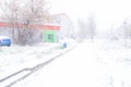 People walk through blizzards low visibility .