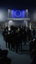 People walk through the border checkpoint gate to Europe union at night - 3D rendered