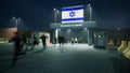 People walk through the border checkpoint gate to ISRAEL at night - 3D rendered