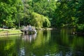 People walk in Botanical park near pond, Palanga, Lithuania