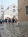 People walk by the Cathedral of St. Anastasia in Zadar, Croatia Royalty Free Stock Photo