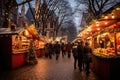 People walk at the Christmas market among fairy lights decorated with garlands on European streets. New Year, outdoor shopping