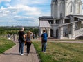 People walk in city park. Kolomenskoye Park is currently part of artistic historical-architectural and natural-landscape museum-