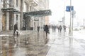 people walk in city streets under snowall b Royalty Free Stock Photo