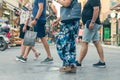 People walk on the colorful mediterranean street on the old Venetian harbor the Chania town at the dusk. Island of Crete, Greece