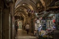 The people walk through the dark market alley in Old Town of Jerusalem, Israel. Royalty Free Stock Photo