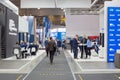 People walk in different stands and sections at the International exhibition of transport and logistics services