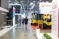 People walk in different stands and sections at the International exhibition of transport and logistics services