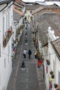 People walk down the famous street known as Calle La Ronda in Quito in Ecuador.