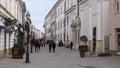 People walk down Kiraly Street in the city of Pecs, Hungary