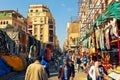 People walk down the one of the market streets of famous Egyptian Bazaar Khan el-Khalili in the heart of Cairo