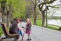 People walk on embankment of the Uzh river. Uzhhorod, Ukraine