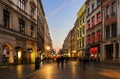 People walk by Florianska street in Krakow