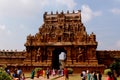People walk in front of the ancient temple second tower-gopura- of Brihadisvara Temple in Thanjavur, india.