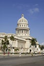 People walk in front of the Capitolio building in Havana, Cuba.