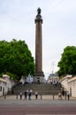 People walk in front of Duke of York Monument on The Mall