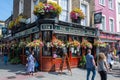 People walk in front of The Elephants Head pub in Camden Town, London