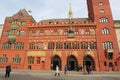 People walk in front of the Town Hall buylding in Basel, Switzerland.