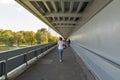 People walk inside UFO bridge in Bratislava, Slovakia.