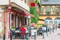 People walk on the main shopping and restaurant street in Kaysersberg, France