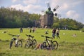 People walk, nature, old mill, a bikes in foreground