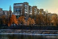 People walk in the park on a clear autumn day.