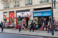 People walk past a popular souvenirs shop on Oxford street in London