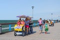 People walk on pier in popular resort town Palanga, Lithuania Royalty Free Stock Photo