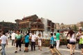 People walk in a square near Qianmen Street in Beijing